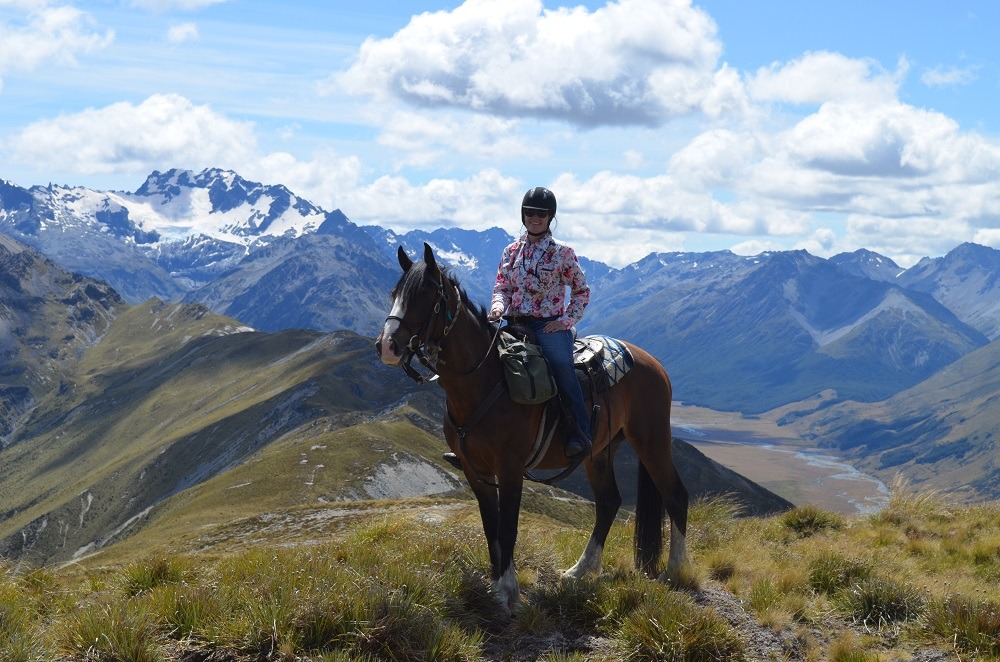 Summiting a mountain on horseback 