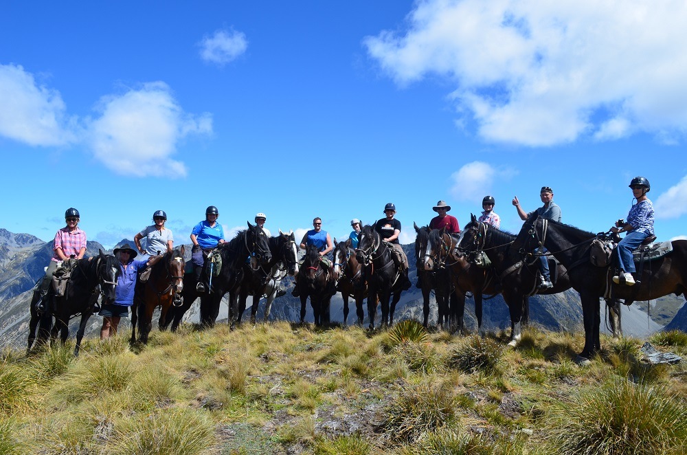 Summiting a mountain on horseback